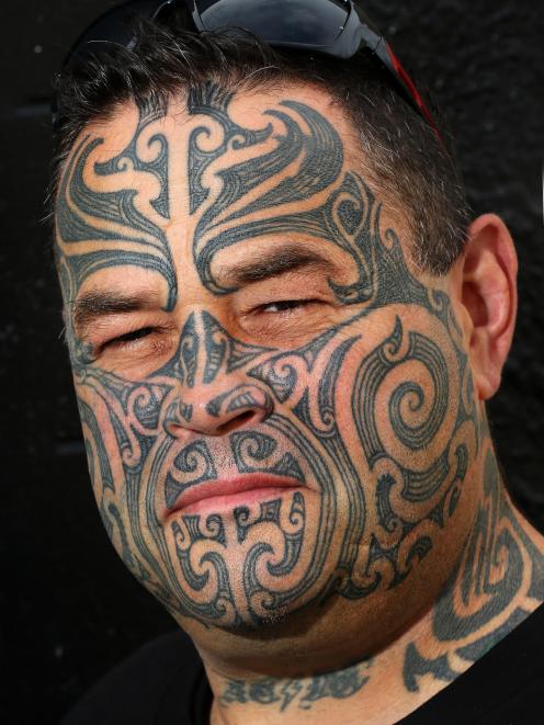  Jamie Addison shows his full-face moko, which represents his Maori culture and the journey he...