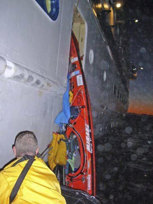 Crew members of the cruise ship Clipper recover a kayak from the Tasman Sea off Milford Sound....