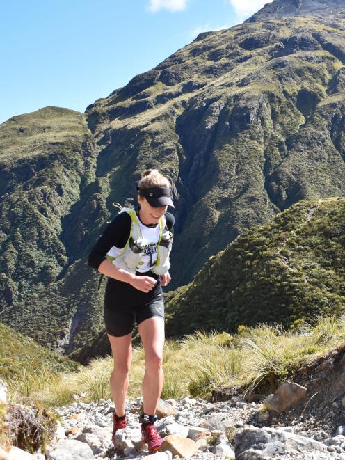 Sara Bradley (Lake Hayes) makes her way over Goat Pass during the mountain run section. 