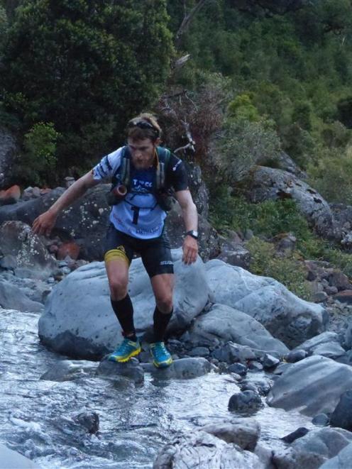 Eventual Coast to Coast winner Sam Clark (Whakatane) negotiates his way through Doreen Creek....