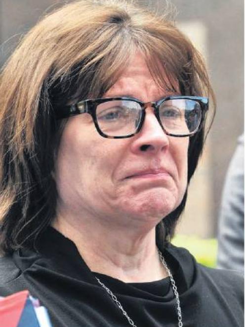 Otago Vice-chancellor Harlene Hayne shows emotion as she speaks at a press conference about the...