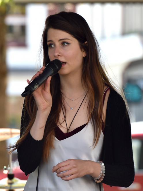 Dunedin musician Molly Devine sings the New Zealand national anthem at a celebration of Waitangi...
