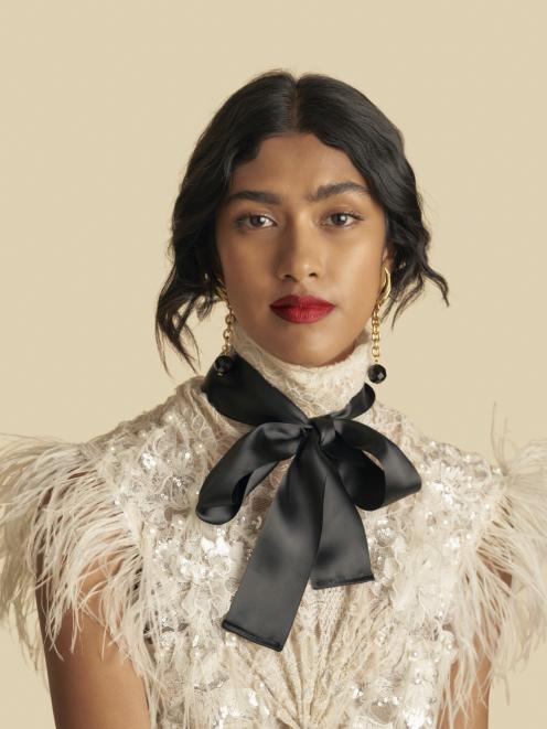 A model wearing Anna Ross' Kester Black lipstick.