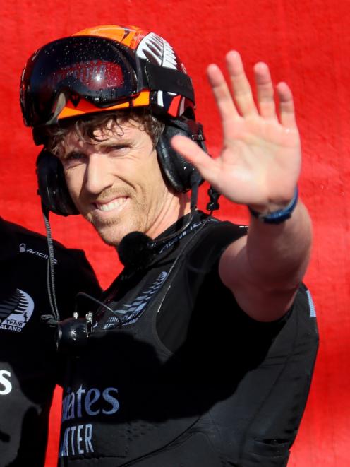 A delighted Team NZ helmsman Peter Burling acknowledges the crowd in Auckland. Photo: Reuters 
