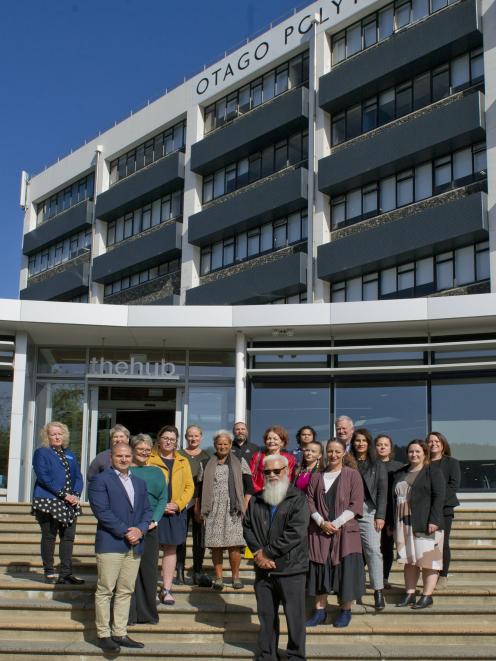 Otago Polytechnic staff and rununga members, standing before the former H Block, newly named...