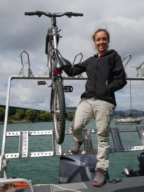 Port to Port owner-operator Rachel McGregor stands by the bike rack on MV Sootychaser. PHOTO:...