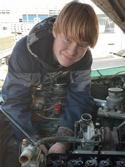 Mac Emeny (15) works under the bonnet of a vehicle at Camco Autos as part of the Central Otago...