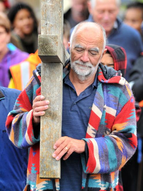 Stephen Macey, of Mosgiel, leads a group of about 30 people from church communities across the...
