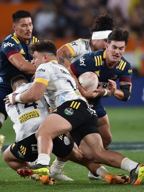 Garden-Bachop looks to move inside Hurricanes backs Billy Proctor (left) and Wes Goosen at...