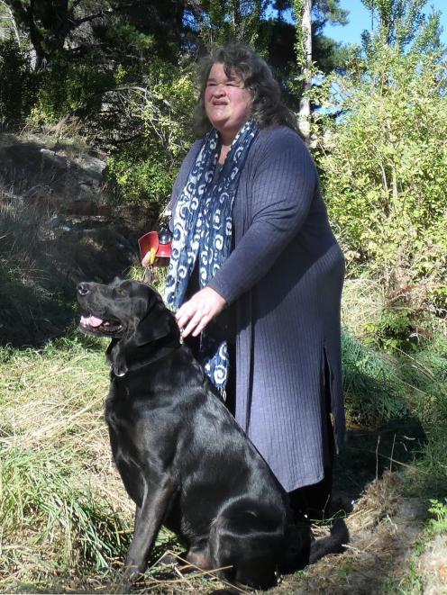  Judy Cockeram and her dog Maestro survey the scene of the crime. PHOTO: SIMON HENDERSON