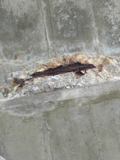 The section of arch from which the concrete appears to have fallen.