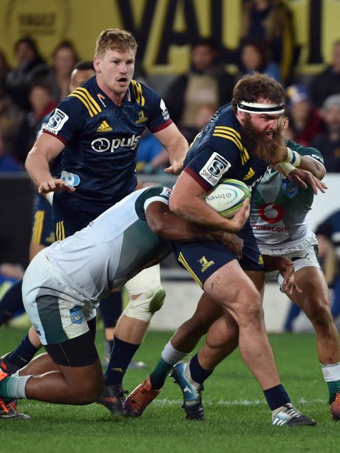 Coltman tries to fend off Hurricanes defenders at Molyneux Park in Alexandra earlier this season.