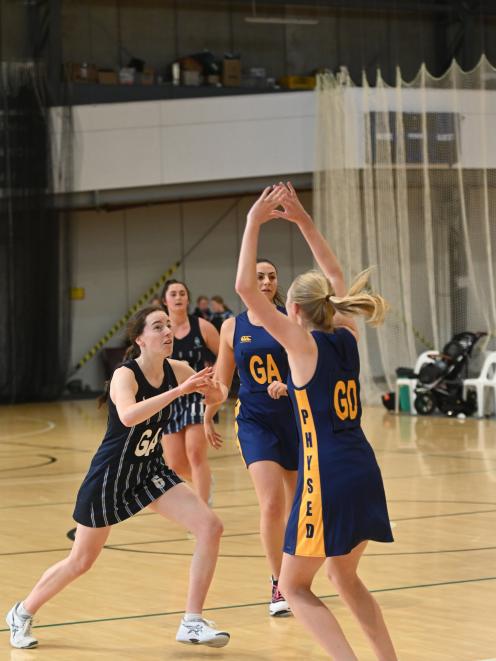 Hunting for the ball are (from left), St Hilda’s Collegiate players Grace Southby and Brooke...