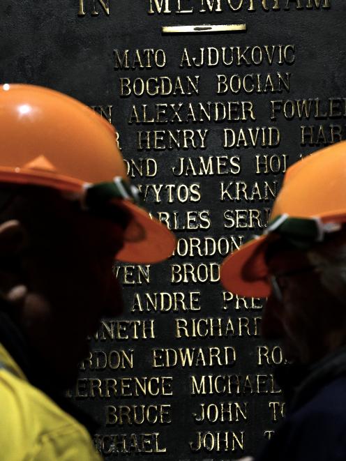 Guests honour the 16 men they worked with during construction of the station who lost their lives.