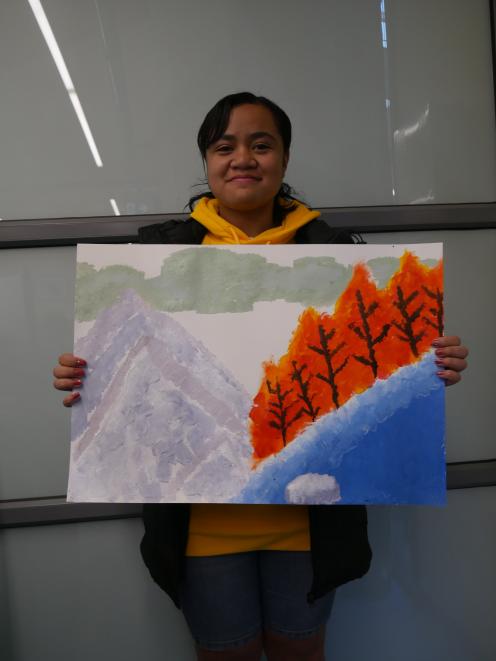 Otago Girls' High School pupil Evelyn Veituna (13) holds the artwork she created, which depicts...
