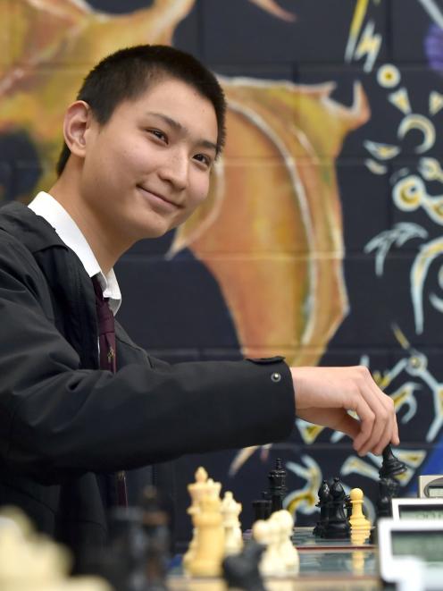 Logan Park High School pupil Alexander Sun makes a move. 