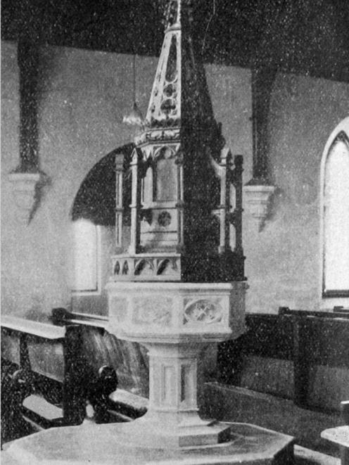 The memorial font canopy at St Peter’s Church, Caversham, constructed of oak and representing a...