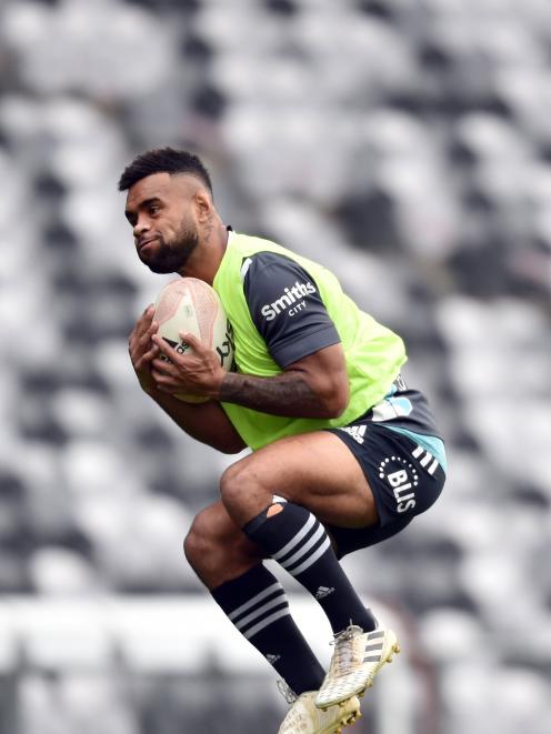 Highlanders winger Jona Nareki takes a high ball at training at Forsyth Barr Stadium yesterday...