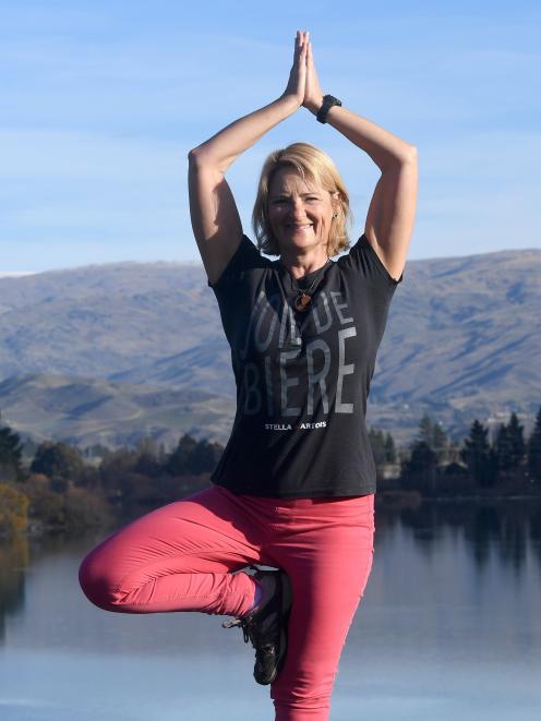 Shelley Charlton loves doing yoga on the beach but has to make do with Lake Dunstan in Cromwell....