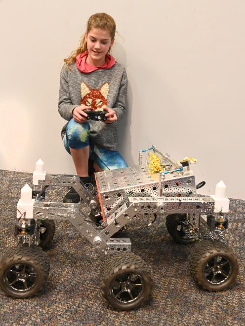 Beth Elder, of Dunedin, controls a scaled-down model of a Mars rover at a New Zealand...