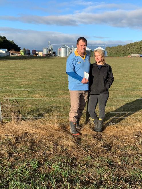 Grain Grower of the Year award winners Morgan and Karen Horrell inspect a winter wheat crop on...