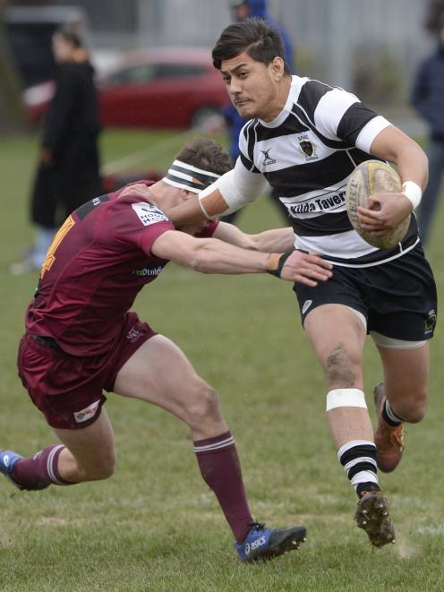 Southern winger Tama Apineru fends off Alhambra-Union defender Isaac Milne during the Dunedin...