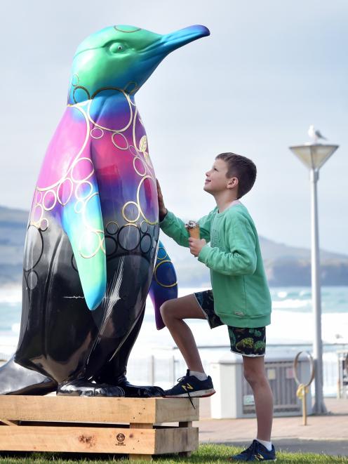 Checking out a 2m-tall penguin sculpture that made an appearance at the St Clair esplanade on...