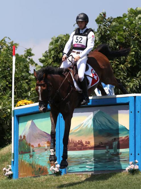 Robin Godel of Team Switzerland riding Jet Set clears a jump during the Eventing Cross Country competition. Photo: Getty Image