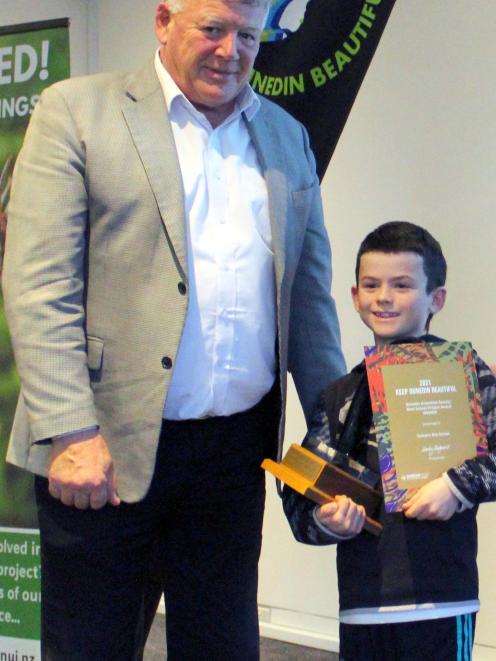 Sawyers Bay School pupil Hunter Swete (10) accepts the Dunedin Amenities Society Best School...