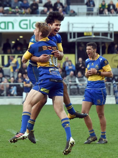 Taieri rugby players (from left) Cameron Millar, William Ngatai and Caleb Leef celebrate their...