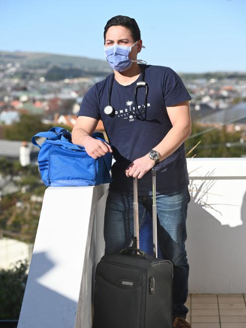 Dunedin ICU nurse Dom Gauthier has his bags packed as he waits on standby to be called to assist...
