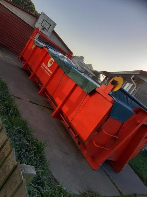 The skip where three-quarters of the family's possessions ended up. Photo: Supplied