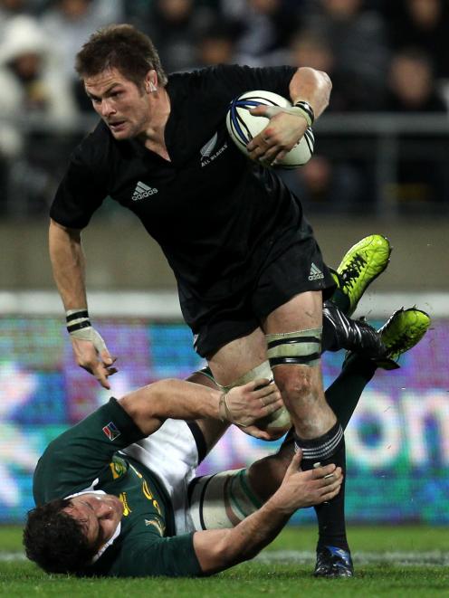 All Blacks captain Richie McCaw tramples over Springboks loose forward Ryan Kankowski in Wellington in 2010. PHOTO: GETTY IMAGES