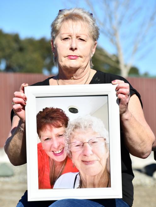 Joanne Watson, holding the last photo taken of her and her mother Nancye MacKenzie, says the...