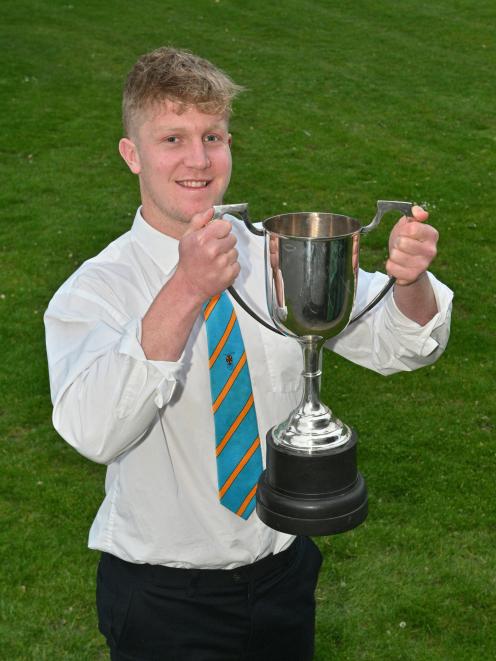 University No 8 Sean Withy with the men’s club player of the year cup he received at the...