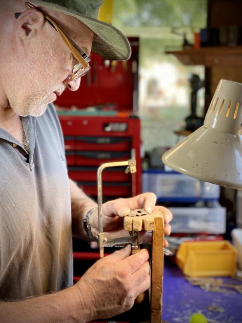 Jeweller Brendon Jaine, of Invercargill, makes a shepherd’s whistle (below) from a spoon. PHOTOS:...