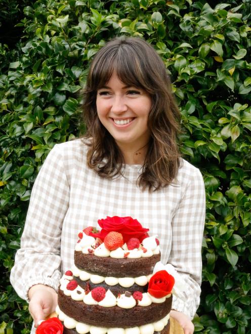 Natasha Cameron holds a chocolate Guinness cake she made for a 21st. PHOTO: SUPPLIED