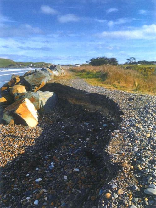 A view of Colac Bay taken from the crumbling coastal road which separates the ocean from an old...