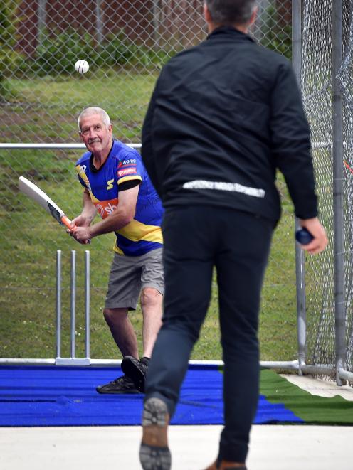 New Zealand cricket great Warren Lees gets on the front foot for a delivery from his son, Greg...