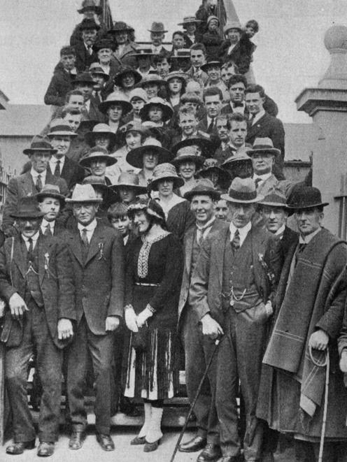 Swimmers pose on the railway station footbridge after giving a reception to Australian star of...