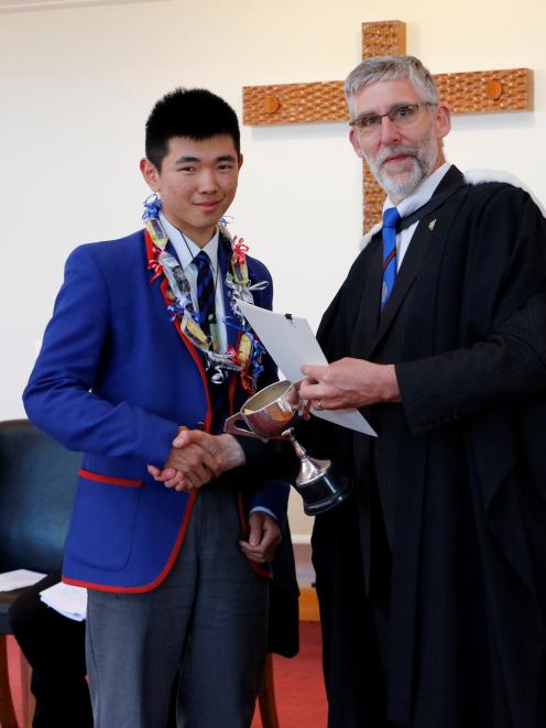 Sun Yi Tao (17) is presented an award by St Kevin’s College principal Paul Olsen. Yi Tao was...