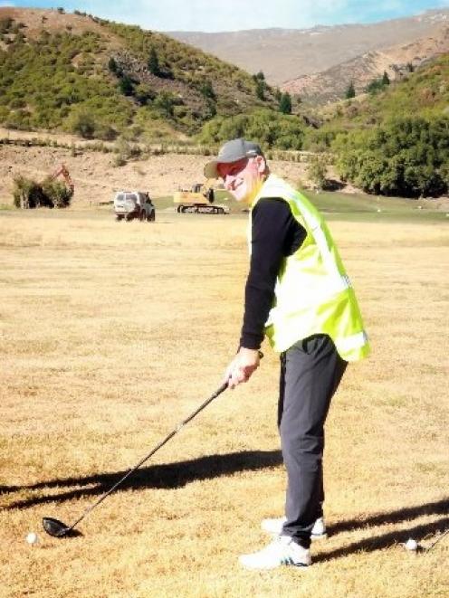 Sir John Key lines up his shot at Gibbston Valley Resort yesterday. Photo: Guy Williams