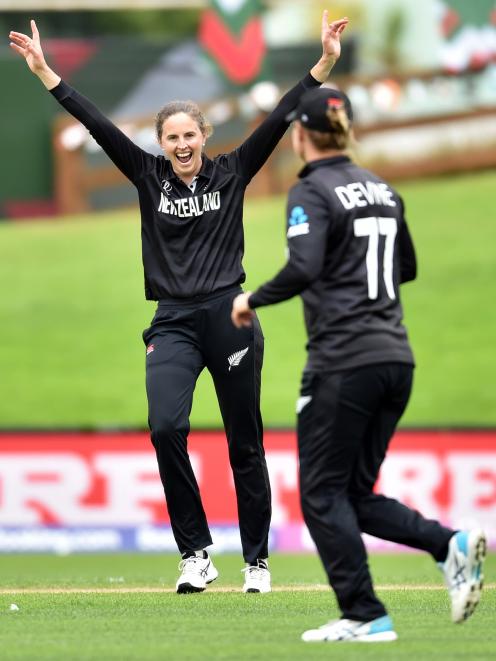 White Ferns part-time off-spinner Amy Satterthwaite (left) celebrates with team-mate Sophie...