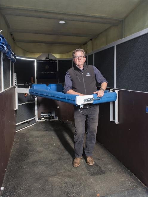 Standing inside the ninth and final Dunedin-built horse ambulance in a nationwide fleet is equine...