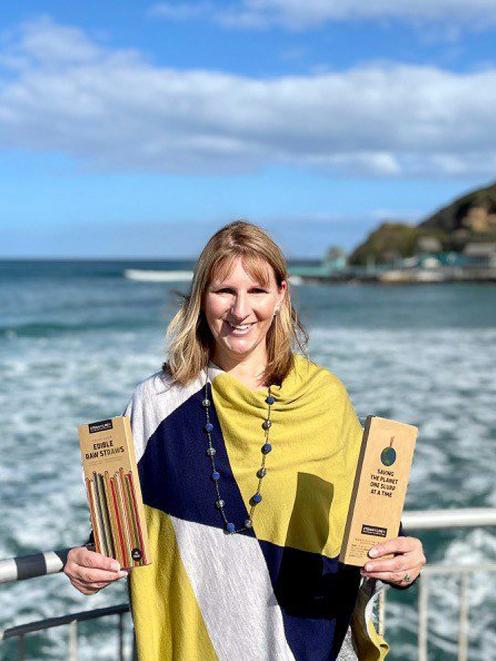 Helen Willis displays Straw the Line NZ’s edible straws at St Clair Beach, Dunedin. PHOTO: SUPPLIED