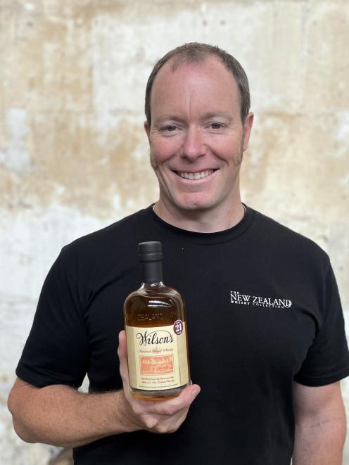New Zealand Whisky Company general manager Michael Byars holds a bottle of Wilsons Whisky. PHOTO:...