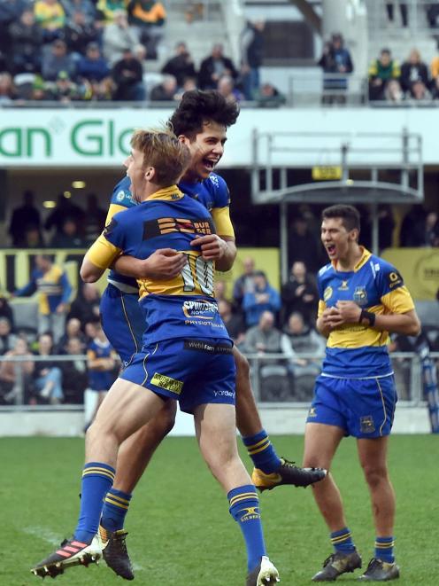 Taieri Eels players (from left) Cameron Millar, Will Ngatai and Caleb Leef celebrate victory over...