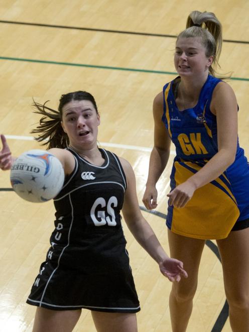 Southern goal shoot Trinity Richardson-Dann tries to reel in a pass as Taieri goal keep Zharna...