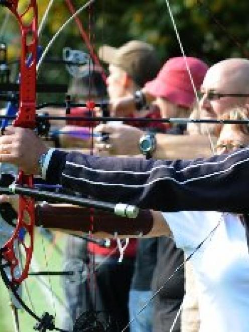 Practising during a club shoot at Chingford Park on Saturday are (from right) Dunedin Archery...