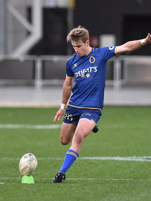 Cameron Miller kicks for Otago. PHOTO: Gregor Richardson